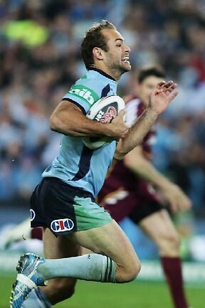 <p>State of Origin II, 2012: NSW fullback Brett Stewart on his way to his second try, in the 44th minute. Picture: Gregg Porteous</p>