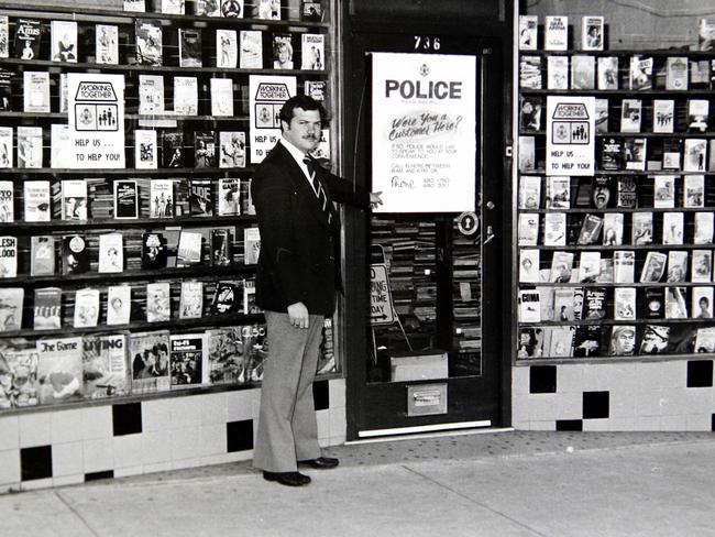 A homicide squad detective outside the Thornbury bookshop where owner Maria James was murdered in 1980.