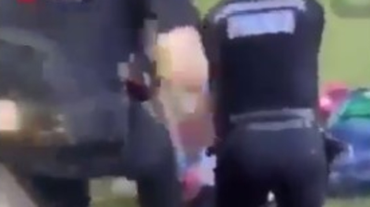 A still from a video that purports to show police working on one of the victims in Reading.