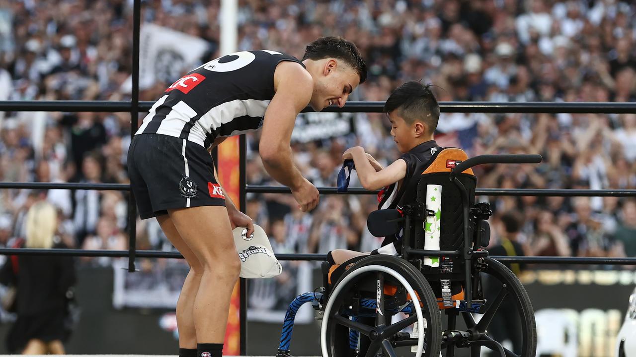 Nick Daicos receives his premiership medal. Photo by Michael Klein