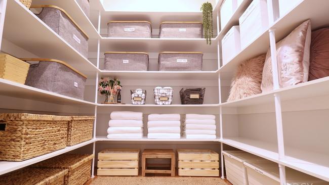 Nina's stunning linen cupboard uses all available space to store linen and bathroom supplies.