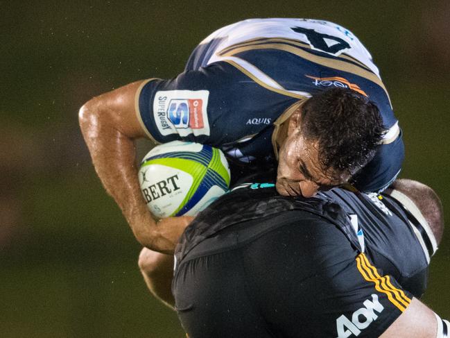 Brumbies lock Rory Arnold is tackled by a Chiefs player on the Sunshine Coast. Photo: RUGBY.com.au/Stuart Walmsley