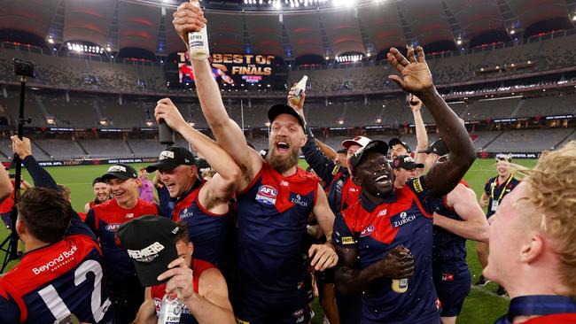 The Demons celebrate their historic victory.