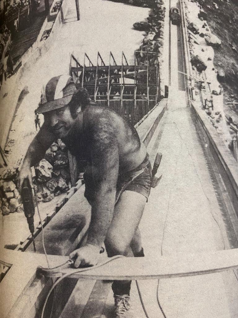 An unnamed worker putting the finishing touches on the log ride at Dreamworld in 1981. Picture: Gold Coast Bulletin archives.