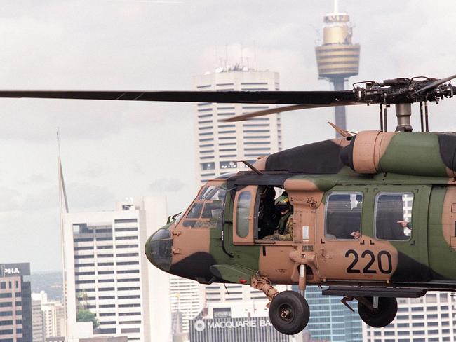 A Black Hawk helicopter flies over Sydney. Picture: Bruce Long