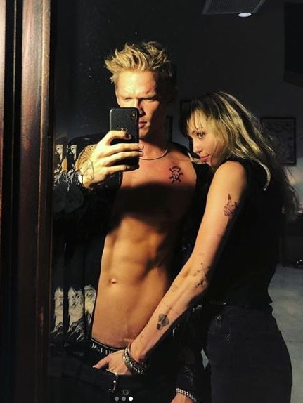 The couple shared a racy selfie, debuting their new tattoos.