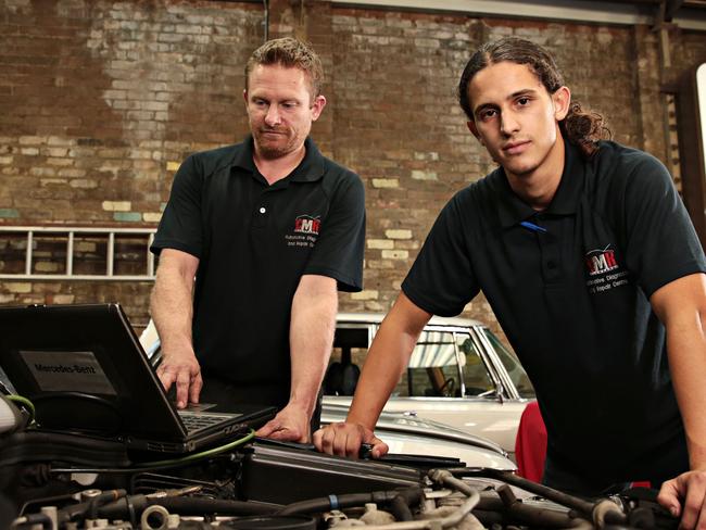 (LR) CMR Automotive owner Cameron Virtue and his first year apprentice Nassim Guellati working on a SL 500 R129 at his garage on the 8th of April. There has been a shortage of mechanics across Australia due to lack of skills, lack of interest in the industry, and an inability to source workers from overseas due to COVID-19 border restriction. Picture: Adam Yip