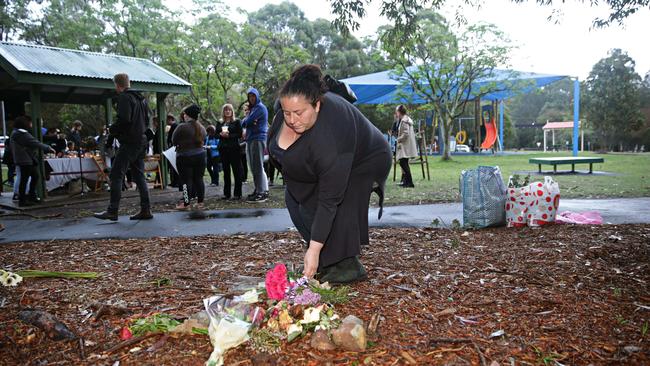 People mourning Nicole Cartwright placed flowers at a vigil at Buffalo Creek Reserve Playground. Picture: Adam Yip/Manly Daily