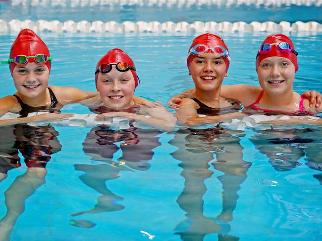 Country kids L-R Seinna Bevan from Broken Hill, Scarlett Molloy from Broken Hill, Charlize Paterson from Gol Gol and Jacinta Morrison from Gol Gol compete at the NSW state primary swimming championships at Sydney Olympic Park this week. Picture: Toby Zerna