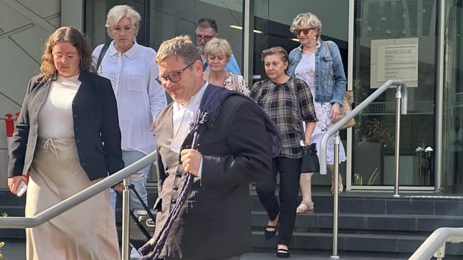 Lawyer Michael Tudori leaves court with his client Bozena Knapinkski and her supporters, after a jury found she was not guilty of poisoning her ex-husband. Picture: Emma Kirk / NewsWire