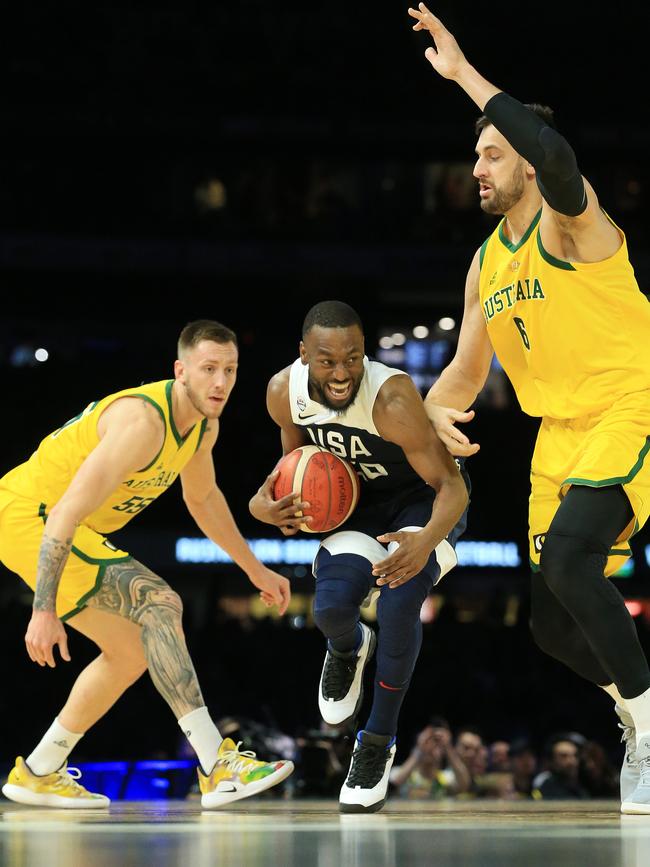 Kemba Walker of Team USA drives past Andrew Bogut of the Boomers. Picture: Mark Stewart