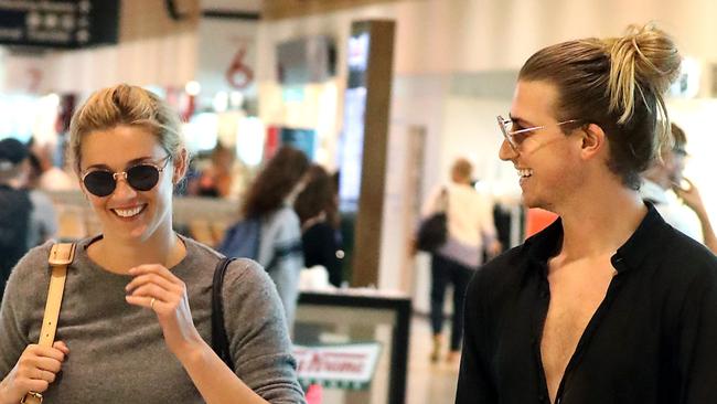 Christian Wilkins accompanies Karl Stefanovic’s girlfriend Jasmine Yarbrough through Sydney airport. Picture: DIIMEX