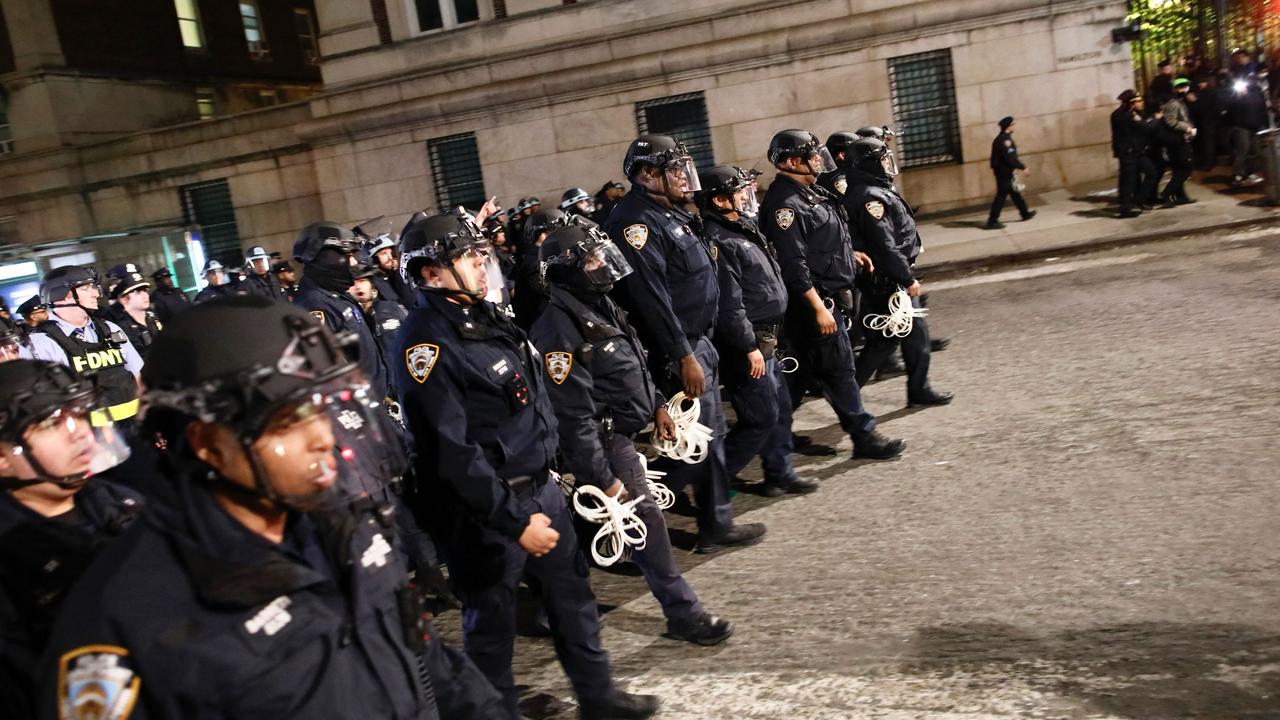 NYPD officers in riot gear march onto Columbia University campus. Picture: KENA BETANCUR / AFP