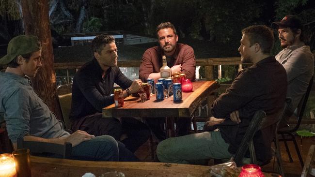 This image released by Netflix shows Garrett Hedlund, from left, Oscar Isaac, Ben Affleck, Charlie Hunnam, and Pedro Pascal in a scene from the film, "Triple Frontier." (Melinda Sue Gordon/Netflix via AP)