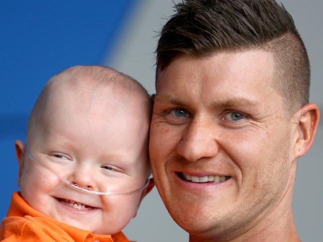 Queensland Children's Hospital intensive care nurse Dakota Parker has been nominated for a Pride of Australia award for the care he gave Ethan Moodie when the baby was there in December last year.  Dakota with Ethan now, and Ethan's Mum Tara Moodie. Pic Bruce Long