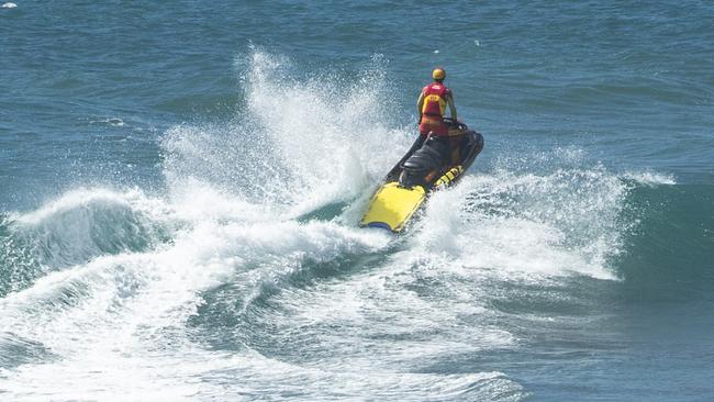 A lifeguard on jet ski does an ocean patrol over first bay Coolum, where a 34 year old Toowoomba woman drowned on Monday morning. Photo Lachie Millard