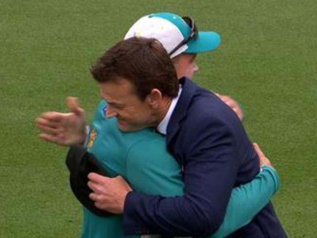 Alex Carey receives his cap from Adam Gilchrist