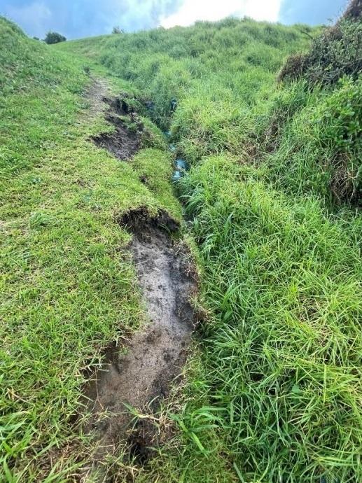 Ridges caused by stormwater overflow on the golf course.