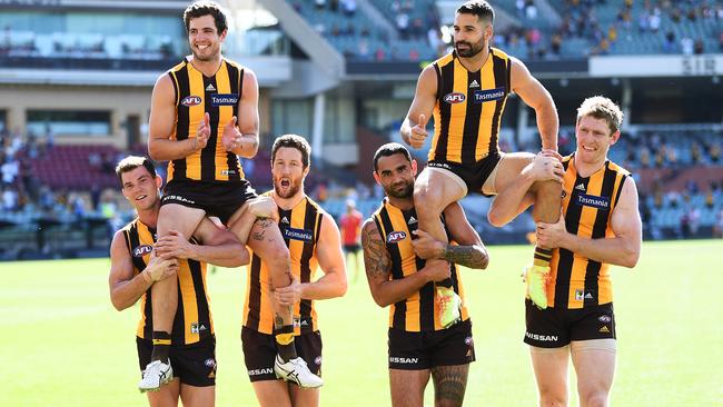 Ben Stratton and Paul Puopolo are chaired off after their final games for Hawthorn. Picture: Mark Brake/Getty Images