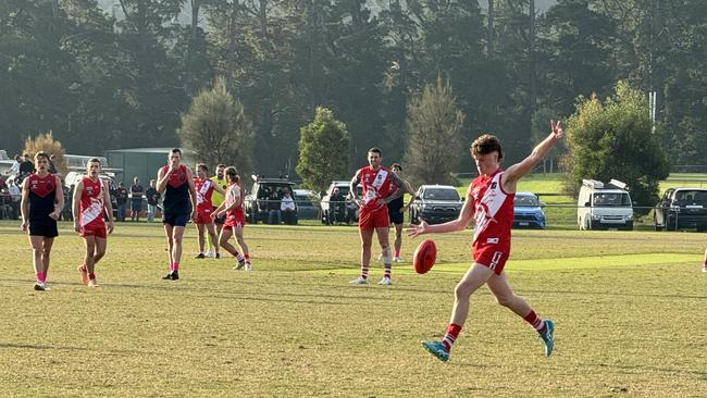 Henry Connolly kicks a goal for Sorrento.