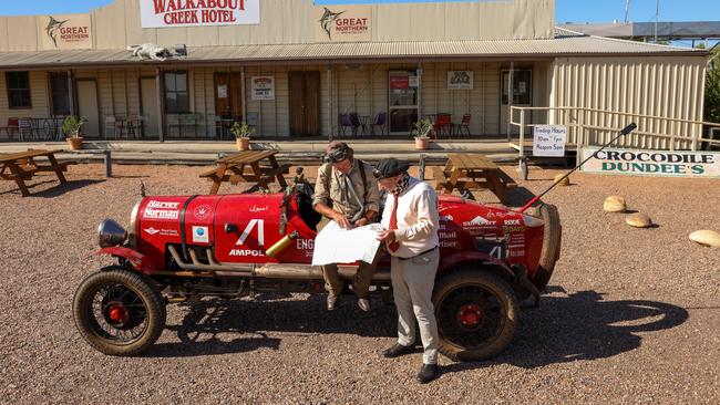 HOTOGRAPHS BY NIGEL WRIGHT., +61 409363339. wrightphoto1@mac.com, 21.01.2095, BIRTLES AND THE BEAN, THIS PHOTOGRAPH SHOWS, IN AUSTRALIA WITH THEIR GLOBE TROTTING, 100 YEAR OLD, CAR, WARREN BROWN AND MATTHEW BENNS ARE RAISING THE RED DUST AND RAISING FUNDS FOR THE ROYAL FLYING DOCTOR SERVICE AS THEY HEAD SOUTH THROUGH OUTBACK QUEENSLAND TOWARDS MELBOURNE., THEY PAUSE, to consider their map IN McKINLAY, a hamlet in outback Queensland at THE ORIGINAL WALKABOUT CREEK HOTELÃ SEEN IN THE CROCODILE DUNDEE FILM., L/r WARREN BROWN & MATTHEW BENNS