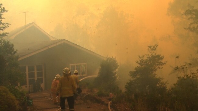 Firefighters work hard to protect homes in the Blue Mountains. Picture: NSW RFS