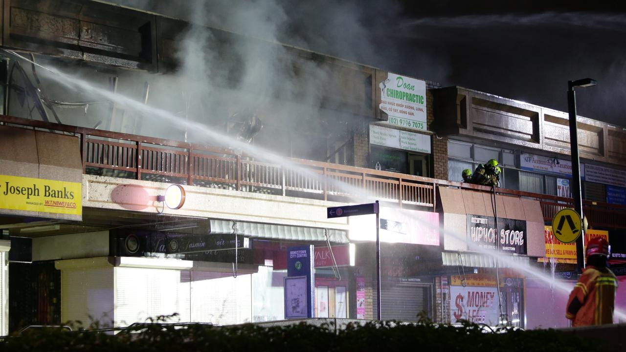 A man has been arrested after a Bankstown office building was destroyed in a fire overnight. Picture by Bill Hearne