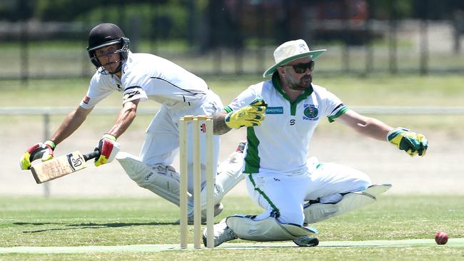 Jordon McDonald dives for the crease as Lance Watts reaches for the ball. Picture: Hamish Blair