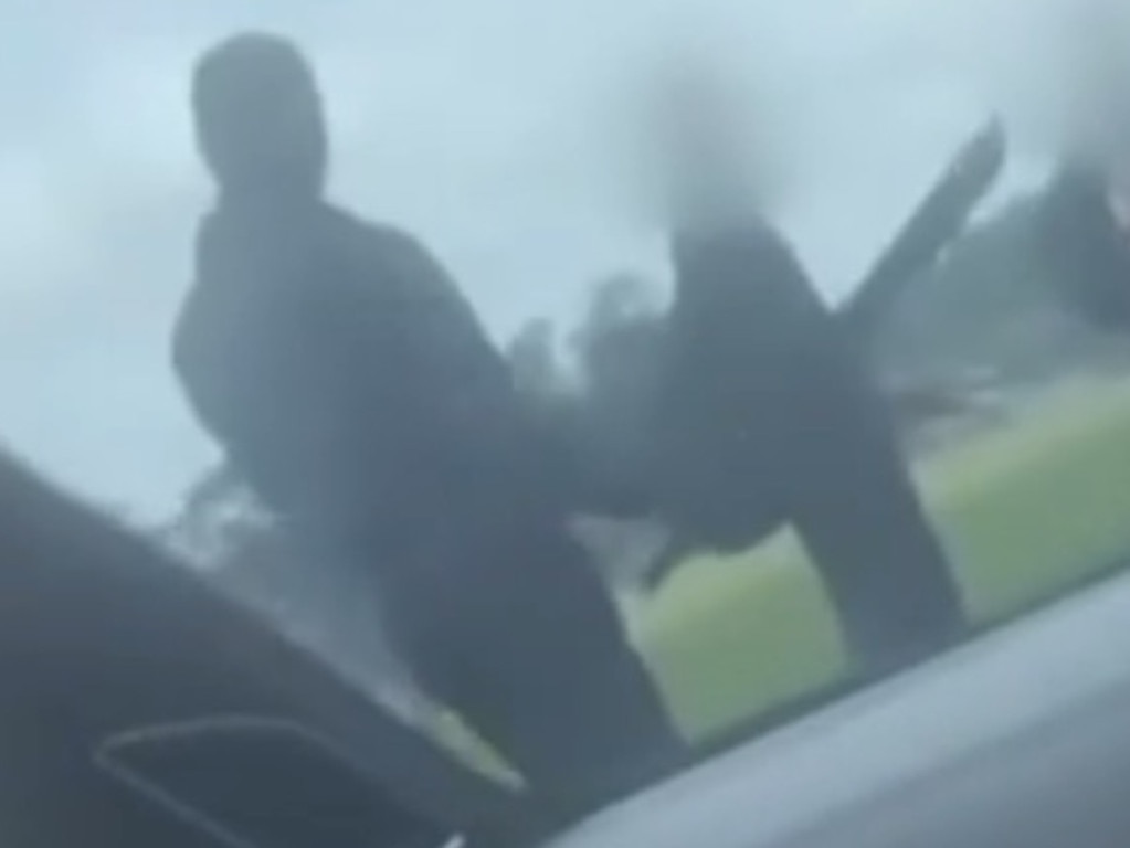 Footage shows a man holding a knife.