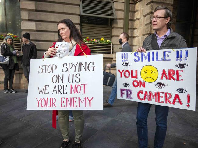 Cathy Byrne and Vassily Koinov protest facial recognition cameras in public places outside the Adelaide Town Hall in 2020. Picture: Emma Brasier