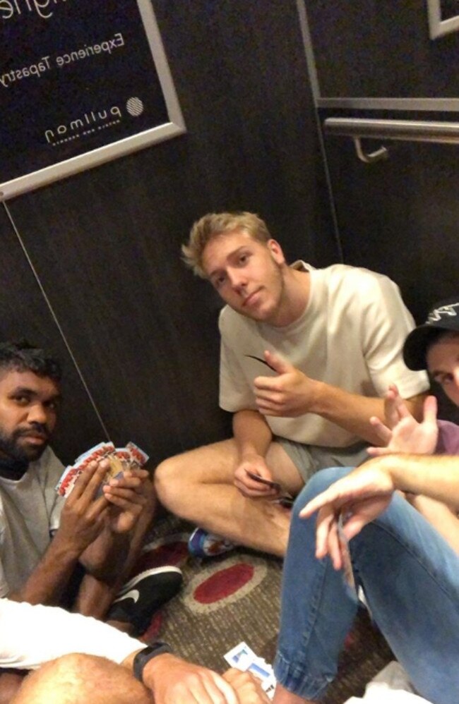 West Coast players enjoy a card game while stuck in a lift on Saturday. Picture: Jack Darling/Instagram. 