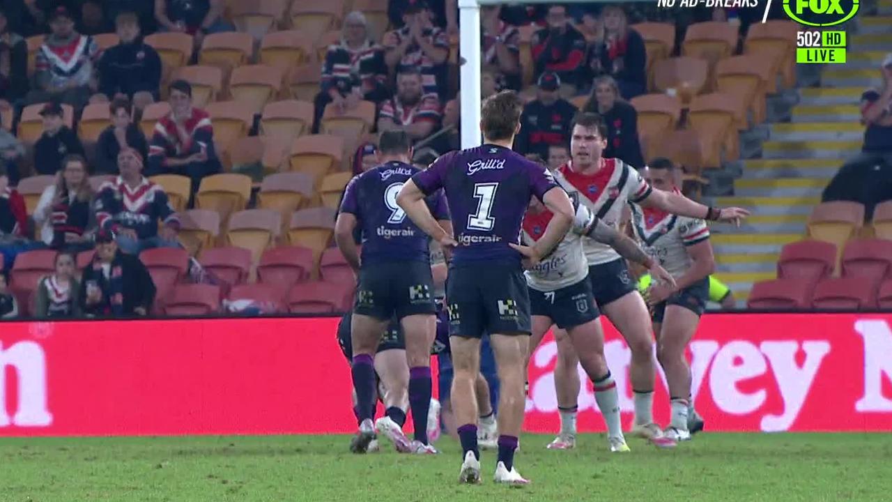 Ryan Papenhuyzen stands with his hands on his hips to trick Angus Crichton and Jake friend into thinking he won't be kicking the field goal.