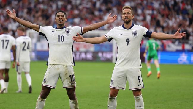 Bellingham celebrates with Harry Kane after scoring his team's first goal against Slovakia. Picture: AFP