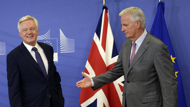 British Secretary of State for Exiting the European Union (Brexit Minister) David Davis (L) is welcomed by European Union Chief Negotiator in charge of Brexit negotiations with Britain Michel Barnier. Picture: AFP