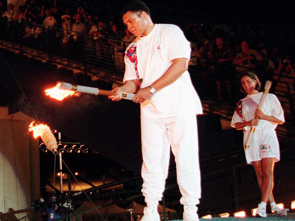 July 19, 1996: Lighting the Olympic flame at the Atlanta Olympic Games.