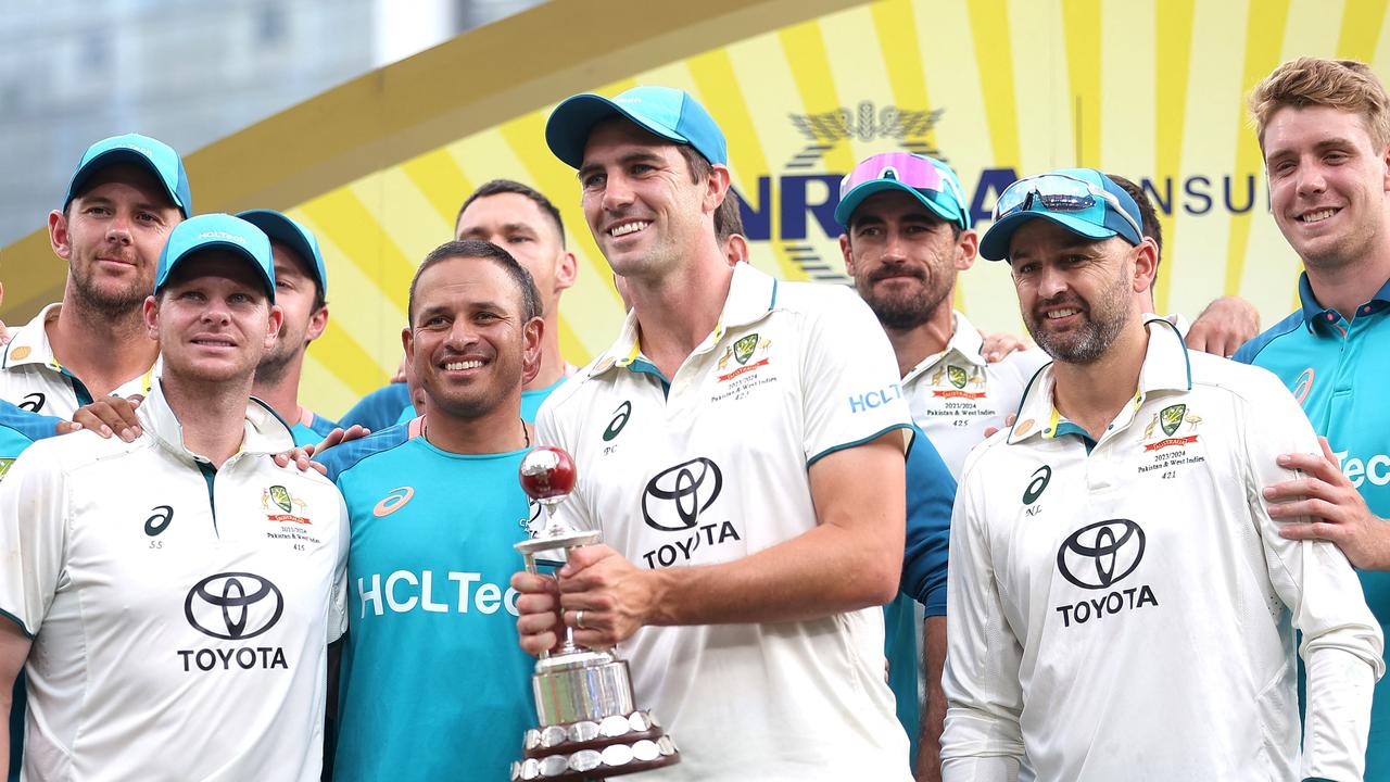 Australia's Test team after retaining the Frank Worrell Trophy. (Photo by Pat Hoelscher / AFP)