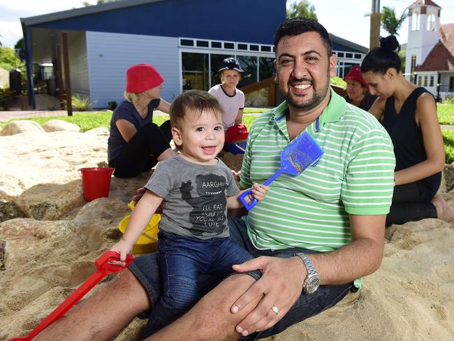 John Nawar, with son George, 1, and fellow childcare workers at the opening of the Amazing Grace Early Learning centre in Railway Estate in 2016. Picture: Wesley Monts