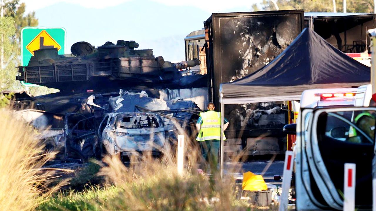 Scenes from the Bruce Highway crash at Bajool with the Army tank in the background. Picture: Steve Vit