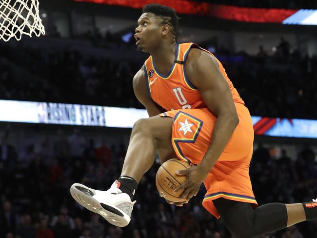 U.S. forward Zion Williamson, of the New Orleans Pelicans, goes up for a dunk during the second half of the NBA Rising Stars basketball game in Chicago, Friday, Feb. 14, 2020. (AP Photo/Nam Y. Huh)