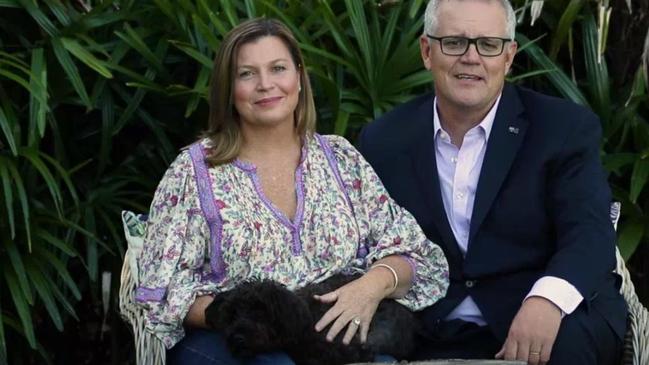 Scott and Jenny Morrison with their little dog Buddy at Easter.