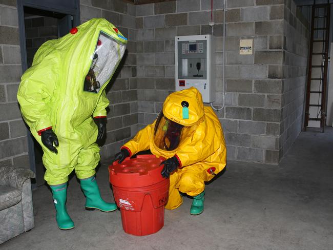 Emergency Services from RFS,Fire and Rescue,SES and Hazmat  give a demonstration to NGO leaders at Natural Diaster forum at Charmhaven RFS HQ .pic Sue Graham