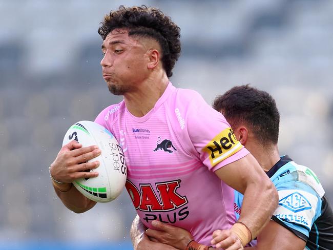 SYDNEY, AUSTRALIA - FEBRUARY 20: Izack Tago of the Panthers is tackled during the NRL Trial Match between the Penrith Panthers and the Cronulla Sharks at CommBank Stadium on February 20, 2022 in Sydney, Australia. (Photo by Brett Hemmings/Getty Images)