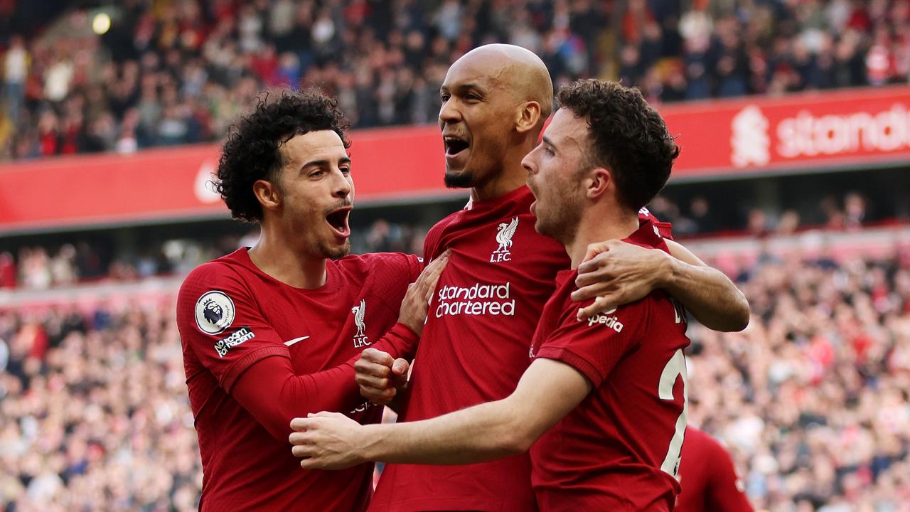 LIVERPOOL, ENGLAND - APRIL 22: Diogo Jota of Liverpool celebrates with teammates Fabinho and Curtis Jones after scoring the team's first goal during the Premier League match between Liverpool FC and Nottingham Forest at Anfield on April 22, 2023 in Liverpool, England. (Photo by Clive Brunskill/Getty Images)