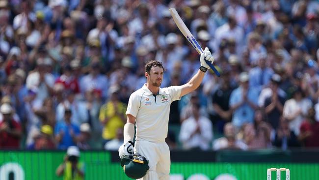 Travis Head celebrates after reaching his century. Picture: AAP/Scott Barbour