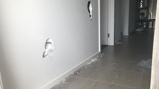 Walls were kicked in as the rioters trashed the house. Picture: AAP/Caroline Schelle