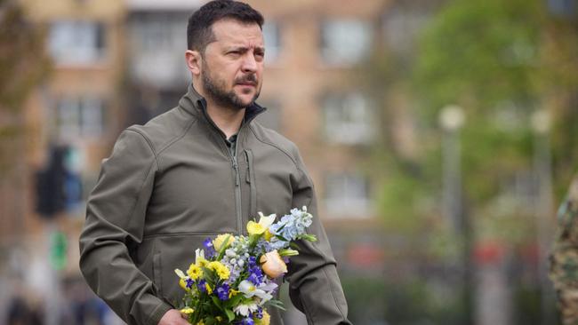 Volodymyr Zelensky lays flowers at a memorial in Kyiv. Picture: AFP.