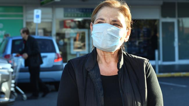 Shopper Yelta, out the front of National Pharmacies at Findon, where a staff member tested positive to Covid-19. Picture: AAP/Mark Brake