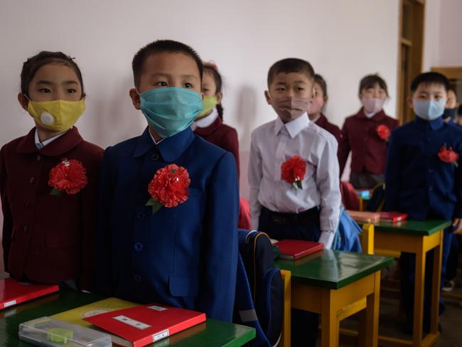 Primary schoolchildren wearing face masks as a protective measure against the COVID-19 in Pyongyang. N. Korea has asked for vaccine help. Picture: AFP