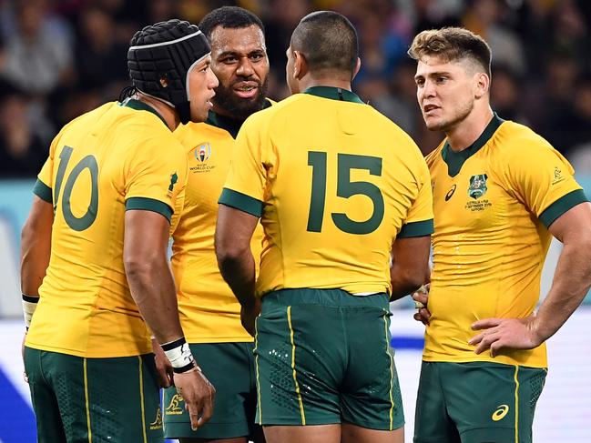 Australia's Christian Lealiifano (L), Marika Koroibete (2/L), Kurtley Beale (2/R) and James O'Connor (R) chat during the Japan 2019 Rugby World Cup Pool D match between Australia and Fiji at the Sapporo Dome in Sapporo on September 21, 2019. (Photo by WILLIAM WEST / AFP)