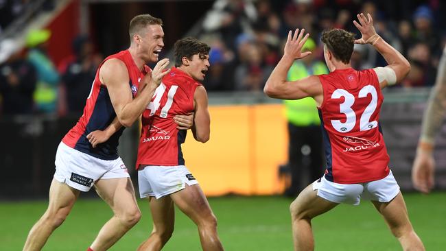 Jay Lockhart of the Demons (second from left) reacts after kicking a goal during the Round 2 AFL match between the Geelong Cats and the Melbourne Demons at GMHBA Stadium in Geelong, Saturday, March 30, 2019. Picture: AAP Image/Julian Smith